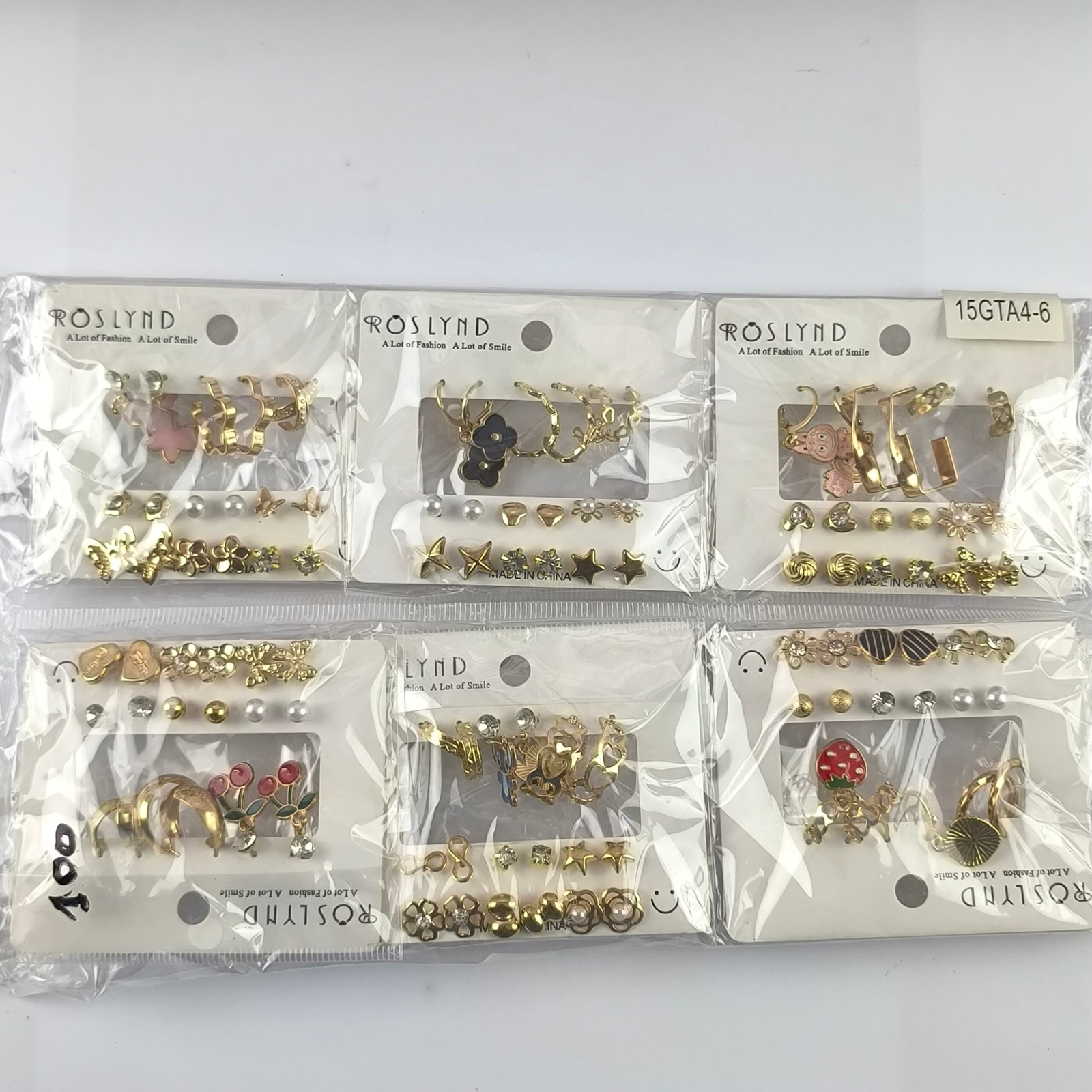 Set de Aretes 9 Pares Dorados con Diseños Variados | Argollas, Figuras y Detalles Elegantes - Image 9