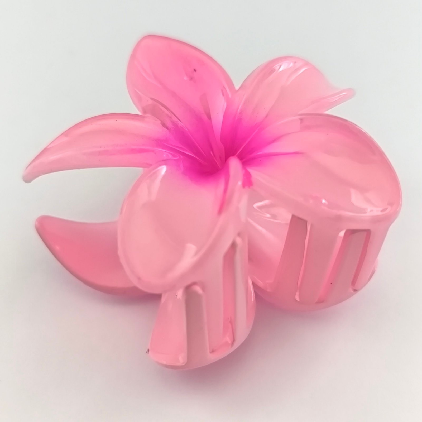 Pirana flor hawaiana rosa claro con centro fucsia plastico semitransparente cabello