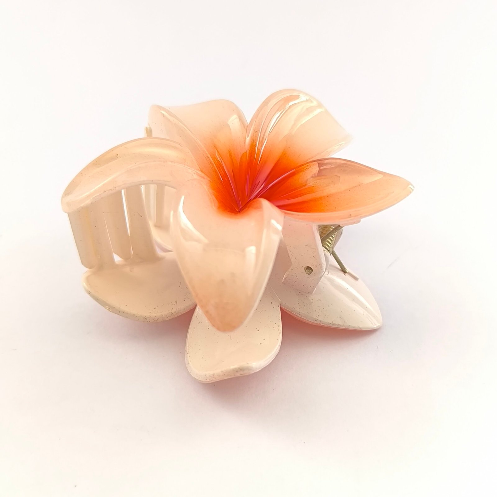 Pirana flor hawaiana color salmon crema con centro naranja plastico brillante cabello