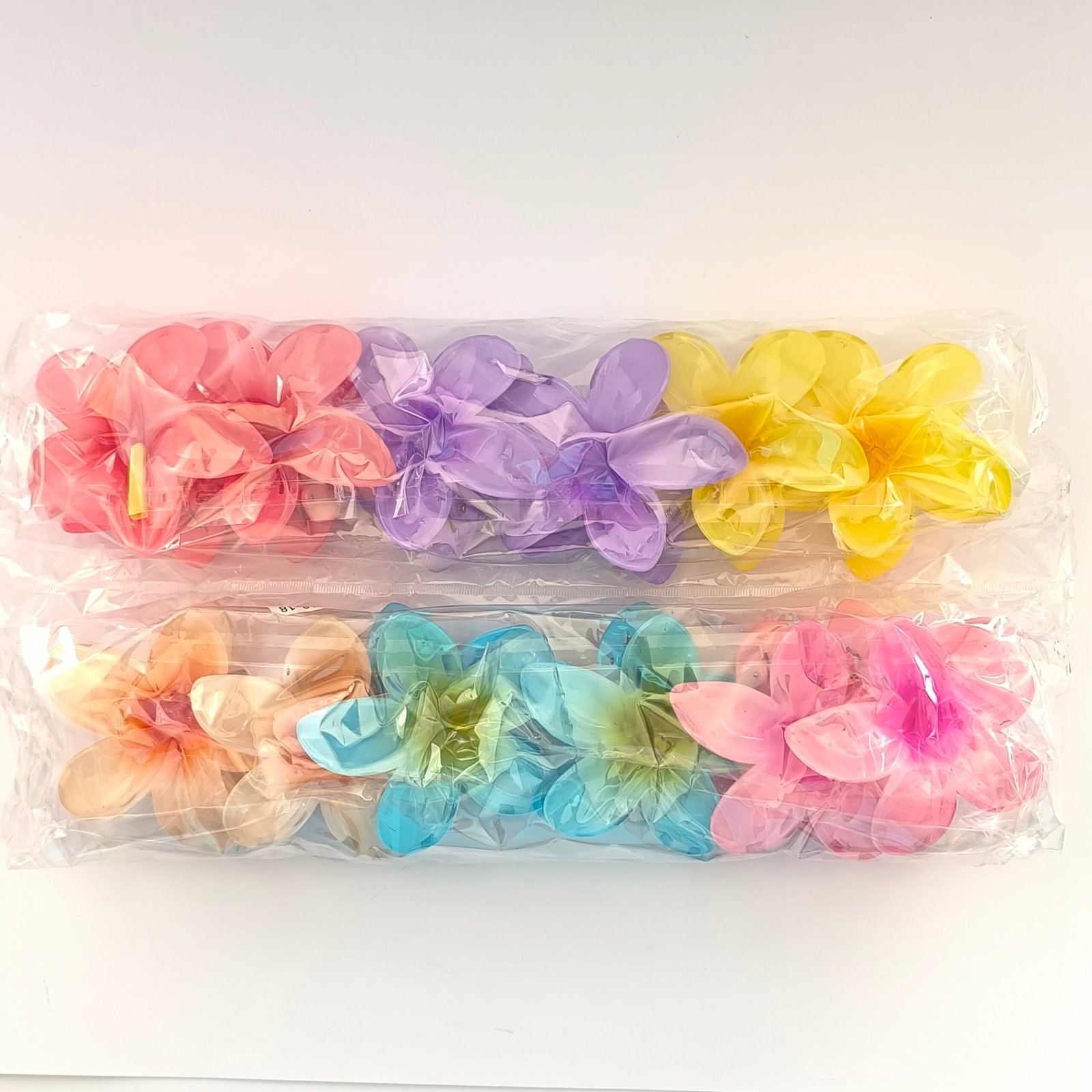 Piranas flor hawaiana plastico semitransparente 6 colores en paquete Bolivia
