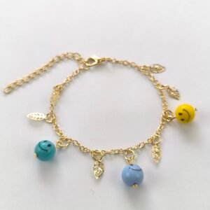 Pulseras infantiles surtidas con carita feliz y dijes, cadena dorada, paquete de 12 unidades.
